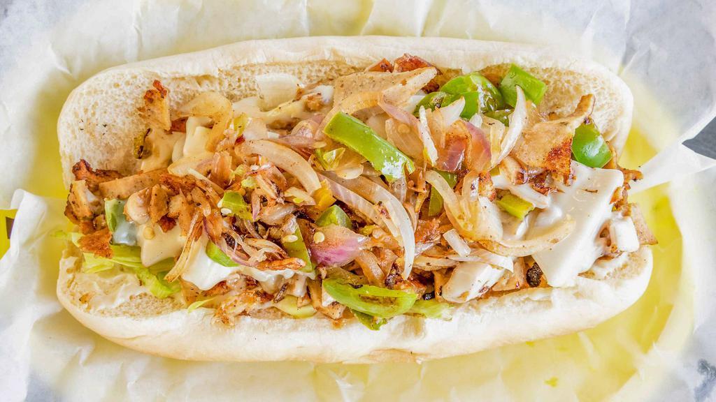 Chicken Gyro Cheesesteak · Chicken gyro slices grilled with onions and green peppers, served with mayo and lettuce on a hoagie.
