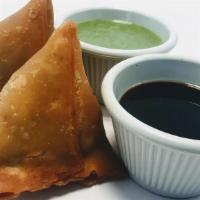 +Samosa · ...hand rolled turnovers stuffed with potato and peas. served with sweet & mint chutneys. (v...