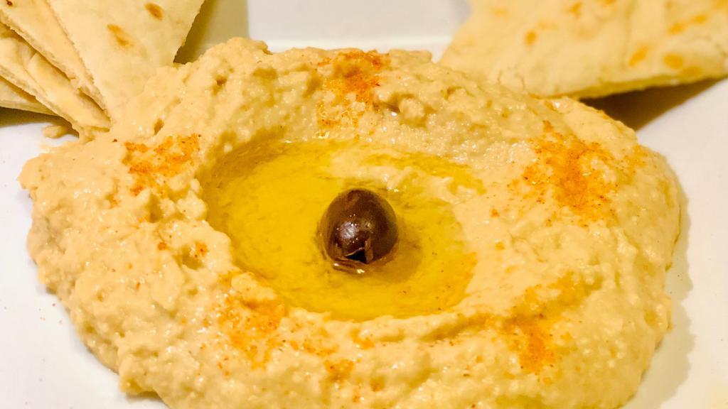 Hummus · Freshly House Made Hummus Served with Warm Greek Pita