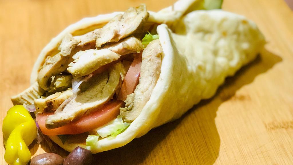 Spicy Chicken Gyro · Spicy Chicken Gyro, Romaine lettuce, Red Onion, Tomato, Cucumber and Tzatziki Sauce Wrapped in Greek Pita.