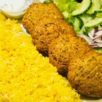 Falafal Veggan Plate · 4 Pieces of Falafal Patties Served over Rice with side of small Greek salad, Hummus and Warm...