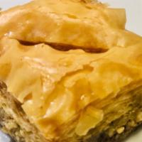 Gree Walnut Baklava · Walnuts and Cinnamon layered between crispy and sweet flaky phyllo dough.