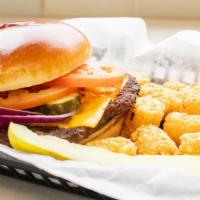 Quaker Cheeseburger · Classic burger with American cheese, lettuce, tomato, onion and pickle on a brioche bun.