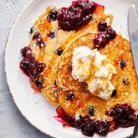 Lemon Blueberry Ricotta Pancakes · 700 Cal. Topped with blueberry reduction, whipped ricotta, Vermont maple syrup.