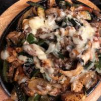 Flaming Cheese Fajitas · Grilled strips of chicken, steak, onions, zucchini, mushrooms, poblano peppers and tomatoes,...