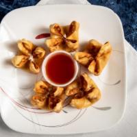 Crab Rangoon · Imitation crab meat, green onions and cream cheese flash fried in a wonton shell.