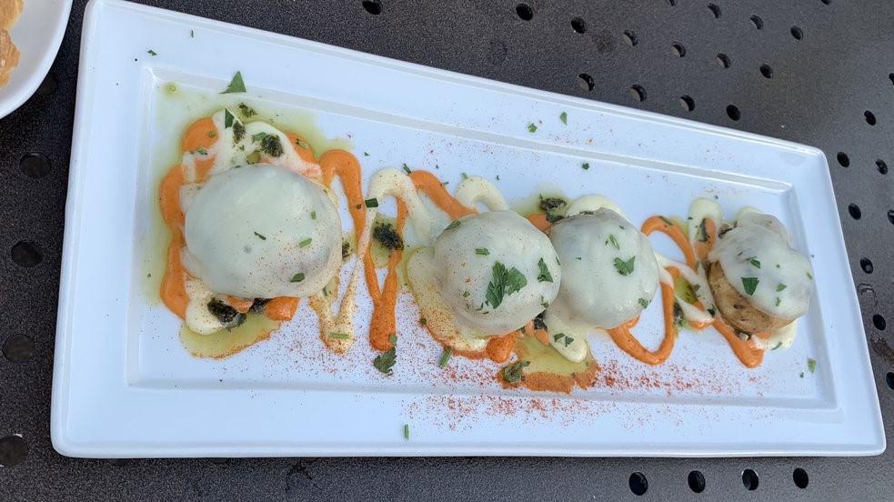Stuffed Mushrooms & Cheese · Gluten free. Fresh mushrooms stuffed with fresh ground pork and our special blend of herbs and spices, covered with mozzarella cheese and served with roasted red pepper sauce.