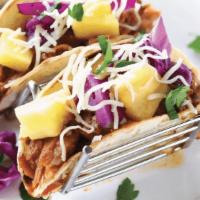 Slow Cooked Carnitas Taco · single taco: slow-cooked pork carnitas, fresh pineapple, diced onion, red cabbage, monterey ...