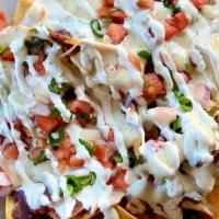 Loaded Nachos · Tortilla chips topped with queso sauce, black beans, pico de gallo and green onions. Side of...