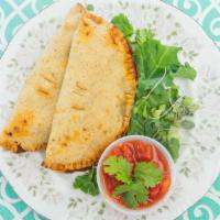 Meat-Filled Empanada · One piece. The empanada is filled with chorizo sausage (grass-fed farm product), black beans...