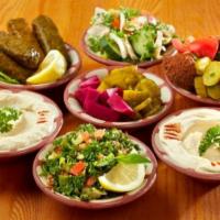 Vegetarian Maza · A classic combination of hommus, baba ghanoush, tabbouleh, fattoush, vegetarian grape leaves...