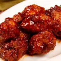 Chicken Wings (6 Pieces) · 6 pieces of traditional wings, lightly breaded and then fried to golden-brown crisp.