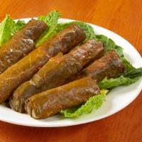 Lamb Grape Leaves · Grape leaves stuffed with lamb, parsley, rice and spices; cooked with lemon, vegetable juice...