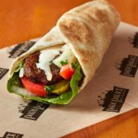 Shish Kafta Sandwich · Ground lamb mixed with parsley, onions and herbs; grilled, then rolled in pita with pickles,...