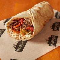 Steak Ghallaba Sandwich · Tender steak tips and vegetables, mushrooms, sautéed with herbs and spices, rolled in pita w...