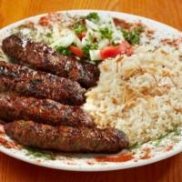 Shish Kafta · Grilled ground lamb with minced vegetables and spices.