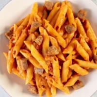 Penne Alla Vodka With Sliced Sausage · Our flagship dish! Delicious Barilla Penne in Vodka sauce, roasted mild Italian sausage topp...