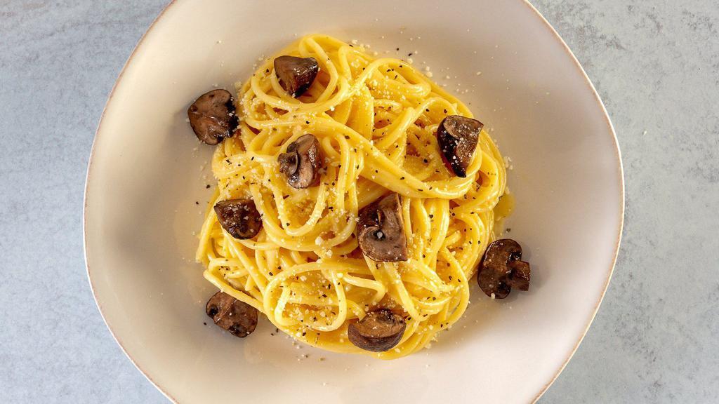 Spaghetti Cacio E Pepe With Truffle-Infused Mushrooms · A traditional Roman pasta dish, with a twist. Barilla Spaghetti in a peppered cheese sauce, Truffle-infused roasted Cremini mushrooms, topped with parmesan cheese.