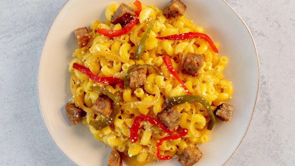 Chicago Style Mac & Cheese · Barilla Cellentani (aka Cavatappi) with a rich cheese sauce, peppers, onions and black pepper, topped with Chicago-style Italian beef and grated parmesan cheese.