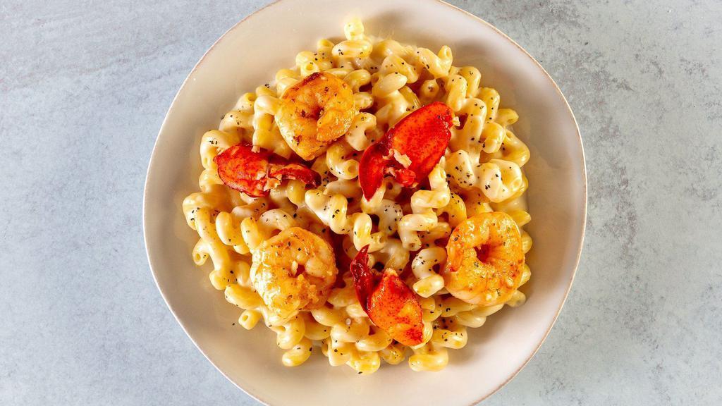 Cavatappi With Lobster And Shrimp · For seafood lovers! Barilla Cellentani (aka Cavatappi) with cheese sauce, topped with shrimp and lobster, seasoned with garlic, lemon zest, herbs and black pepper.