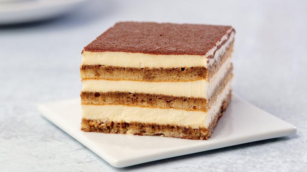 Tiramisu · What's more Italian than a delicious Tiramisu? Enjoy this genuine national dessert - layers of sponge cake soaked in coffee with powdered chocolate and mascarpone cheese.