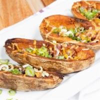 Badger Potato Skins · Wisconsin Shredded Cheddar, Bacon, Scallions & Sour Cream Add Grilled Chicken for an additio...
