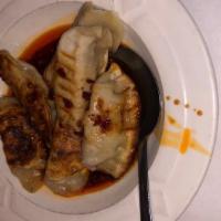 Szechuan Dumplings (6) · Hot. Dumplings with ground pork and vegetable filling in spicy szechwan sauce.