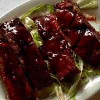 B.Q. Spare Ribs (4) · Lean, meaty pork ribs covered with gourmet barbeque sauce.