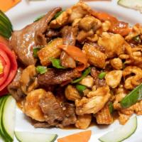 Chi Thai Combination · Sliced tenderloin of beef, breast of chicken, jumbo shrimp, sautéed, then simmered with mush...