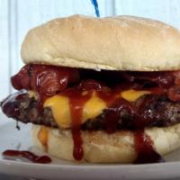Pub Burger · Char-grilled burger layered with American cheese, bacon and BBQ sauce.