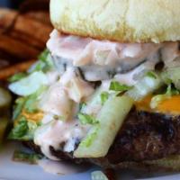 All American Burger · Char-grilled burger layered with American cheese, lettuce, red onion, pickles, and house tho...