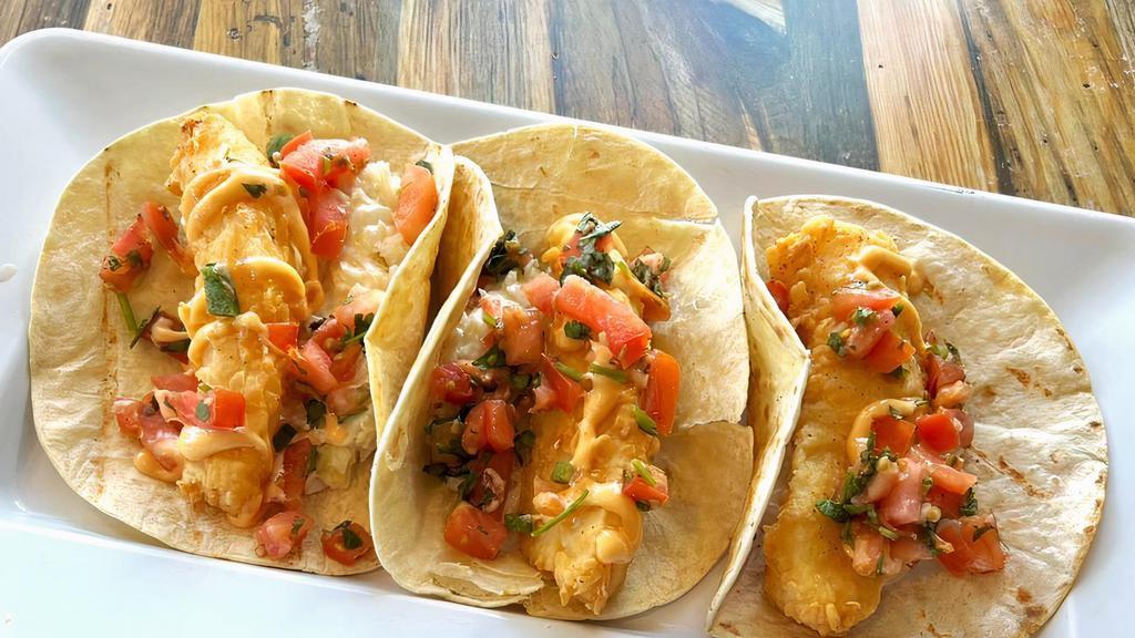 Crispy Fish · Hand battered cod fillets in our signature recipe and golden fried. Layered in flour tortillas with coleslaw, pico de gallo and spicy aioli.