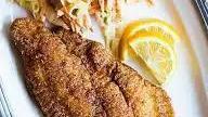 Catfish Fillet Dinner · Hand breaded and served with choice of sauce, French fries and Coleslaw.