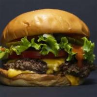 Classic Cheeseburger · 1/2 lb. beef burger topped with lettuce, tomatoes, onions, pickles and choice of American or...