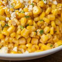 Elotes · Mexican street corn with cotija cheese, mayo, margarine, and spices.