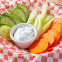 Fixins · Carrots, celery, and cucumbers with dip.