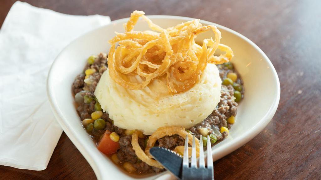 Shepherd'S Pie · Seasoned lamb and ground beef, stewed with peas, corn, carrots, and onions in our Tavern-made gravy and topped with mashed potatoes.