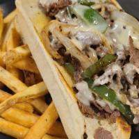 Tavern Philly Cheese Steak · Thinly sliced sirloin, smothered with grilled onions and peppers, then topped with Swiss che...
