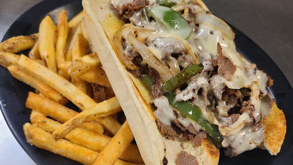 Tavern Philly Cheese Steak · Thinly sliced sirloin, smothered with grilled onions and peppers, then topped with Swiss cheese. Served on a grilled hoagie roll. Comes with a side of seasoned fries at no additional cost or a different side option for an upcharge.