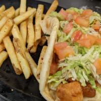 Irish Chicken Flatbread · Crispy fried chicken served in a grilled flatbread pita with American and Swiss cheese, lett...