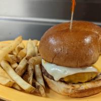 Triple Cheese · Fresh 1/2 pound patty topped with American cheese, Swiss cheese, cheddar cheese, tomato, let...