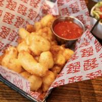 Cheese Curds · Served with herb ranch dressing