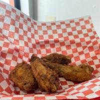 Bone-In Chicken Wings · Breaded chicken wings tossed in your choice of sauce, served with french fries.