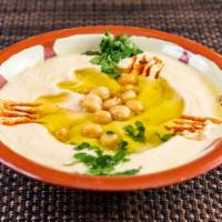 Hummus · Puréed chick peas enhanced with tahini, virgin olive oil, and lemon.