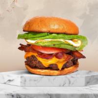 Morning Mystery Burger  · American beef patty topped with bacon, fried egg, avocado, melted cheese, lettuce, tomato, o...