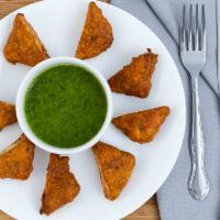Paneer Pakora · A thin slice of Indian cheese dipped in chickpea flour and fried.