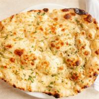Garlic Nan · House-made nan with fresh garlic baked in our tandoori oven, served soft and golden brown.