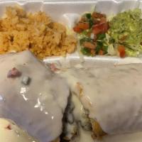 Beef Chimichanga · Flour tortilla, filled with rice, refried beans, and seasoned ground beef, rolled and deep f...