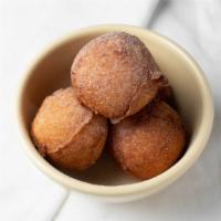 Beignet (Puff Puff)  - 1 Cup · Fried donut hole served plain, with power sugar, or with chocolate ganache.