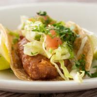 Fish Tacos · 3 grilled fish tacos topped with pico de gallo.